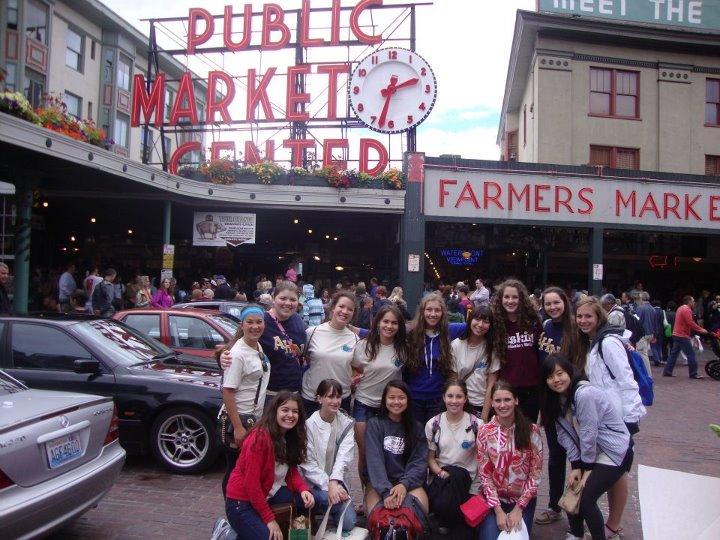 Academt girls stand in from of the famous Pikes Market in Seattle, Washington.