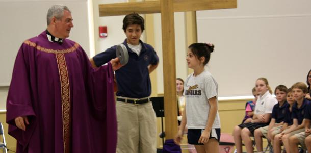 Students run the race at Ash Wednesday Mass