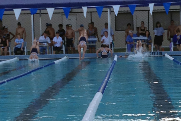 Senior Clare Flemming dives into the water.