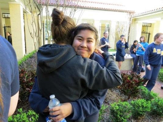 Colleen Driscoll comforts fellow Academy friend and Filipino Denny Abraham