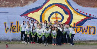 Jonestown missionaries celebrate their accomplishment after a long day of hard work.