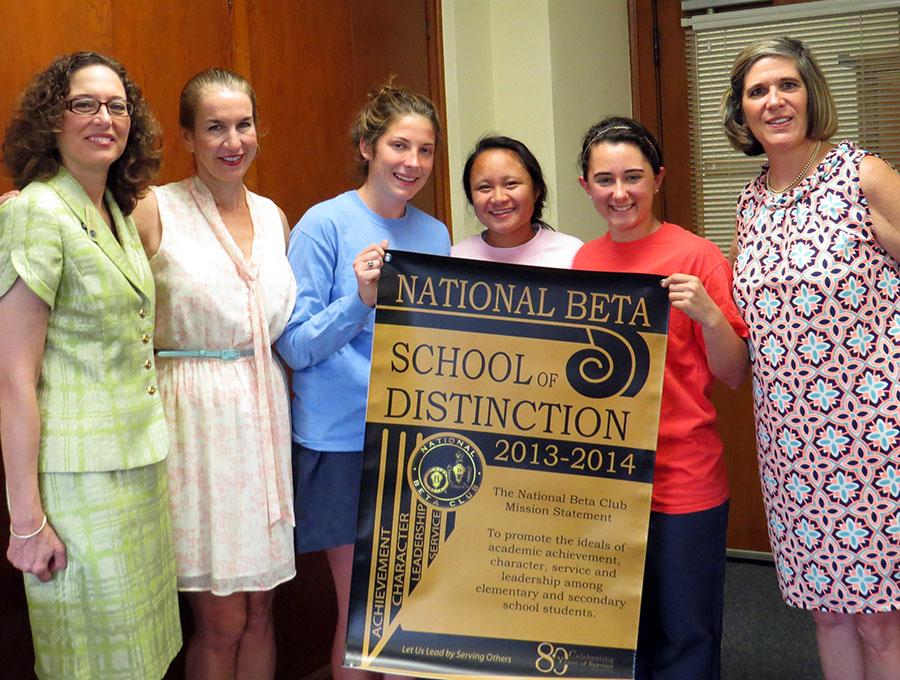 Principal Camille Jowanna presented the honor to Beta members Alison Foley, Carmelle Kuizon, and Caroline Kimbler.