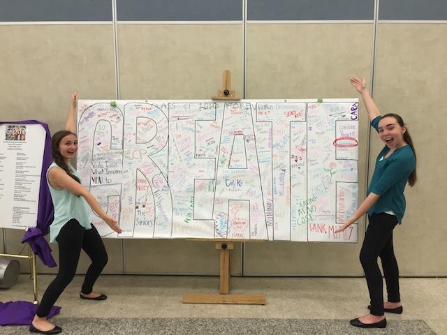 Sophomores Leila Zupsic and Kathryn Byers pose next to the CREATE sign.
