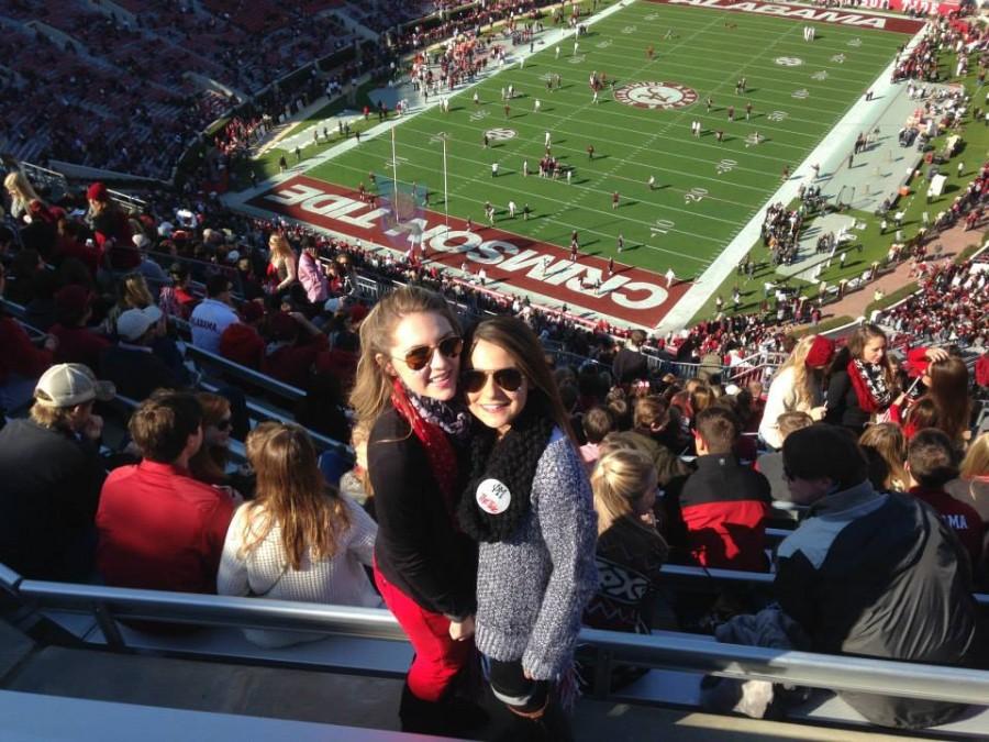 Senior Remi Storch and alum Chloe Storch cheering on the Crimson Tide last season.