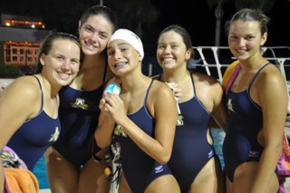 Swimmers (left to right) Ashley Anderson (10), Maddie Ruppel (10), Nina Alberdi (10), Isabella Bahr (9), and Charlie Young (9) are getting ready to swim their events. 