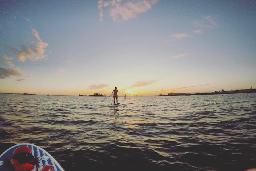 Seniors Karlee Nipper and Audrey Cooper close out the summer with the last Tuesday night sunset paddle at Hula Bay. Theyre sad because its over, but smiling because it happened.