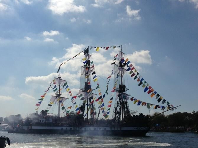 
The day begins with the Invasion of the Pirates which involves a parade of boats trolling through the bay as the main ship see in the photo leads.