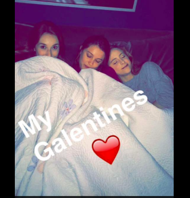 Megan and friends celebrating Galentines day together with chocolate and a movie