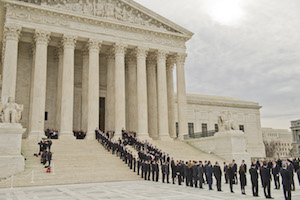 Former law clerks of Justice Antonin Scalia line up as he is brought into the Supreme Court. 