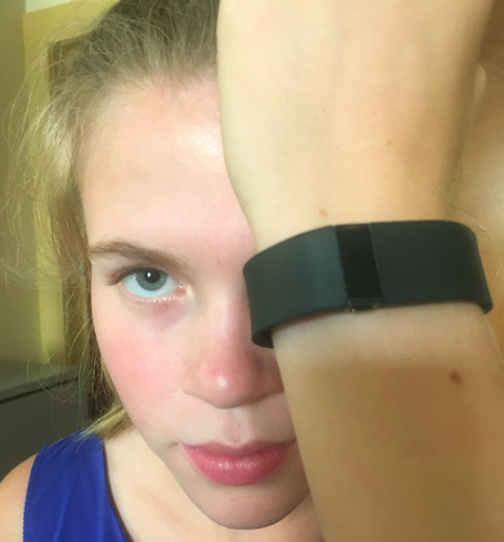 Junor Megan Przedpelski shows off her Fitbit Charge HR. 