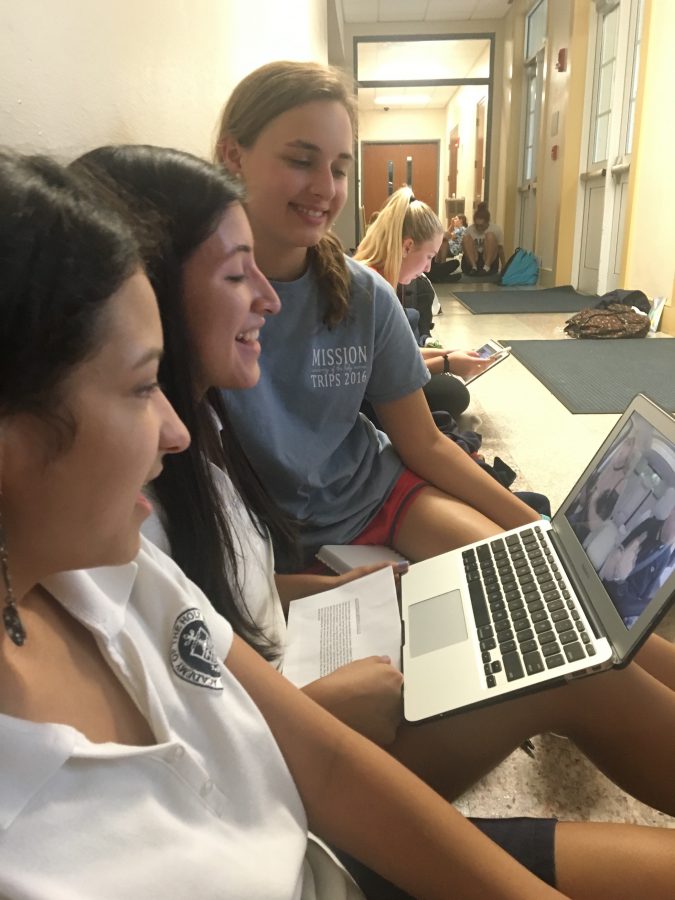 Academy Seniors, Victoria Quinones, Ally Pazzi, and Alessandra Nies huddle together in anticipation as they sing along to the newest Carpool Karaoke with Britney Spears 