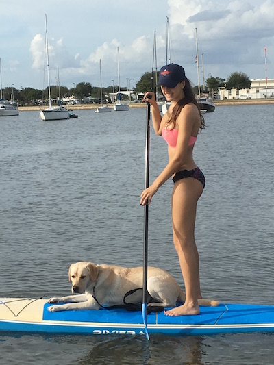 Credit: Devin Folkman/Achona Online Senior Devin Folkman paddle boards with her puppy on a hot summer day. 