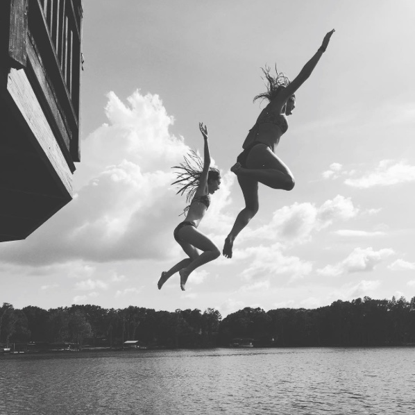 Seniors Allison Wehle and Lexi Diez enjoy a hot day by swimming in a lake on vacation. Swimming for one hour at a moderate pace can burn up to 400 calories!