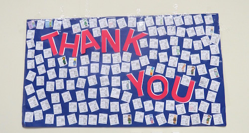 Academy students wrote thank you notes to military men and women and displayed them at the assembly. Credit: Emily Hoerbelt/Achona Online