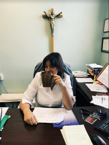 Principal Nitchals ready to take on a weekday at AHN, coffee in hand.