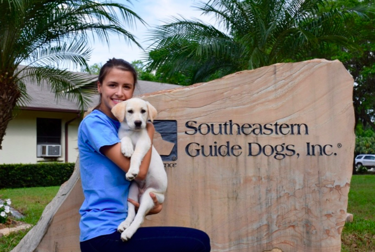 Folkman poses with Suba moments after picking him up from Palmetto, Florida, to begin his obedience training. Credit: Devin Folkman/ Achona Online 