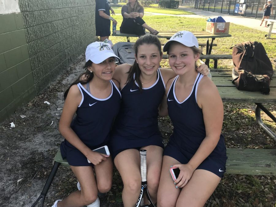 Isabella Duarte, Katherine Rodriguez, and Maddie Chandler rest before doubles matches. Photo Credit: Sara Phillips/ACHONAOnline