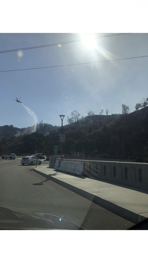 
Helicopters had to fly over the hills to try to contain the wildfire. 