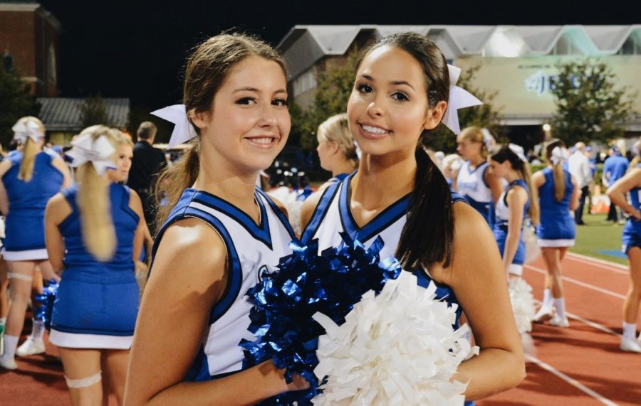 Lee (left) and Bissett (right) have both been members of the cheer team for four years. 
