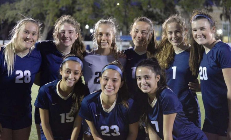 The senior members of the soccer team celebrate their senior night on January 17. The team earned a 1-0 victory over St. Petersburg High School.