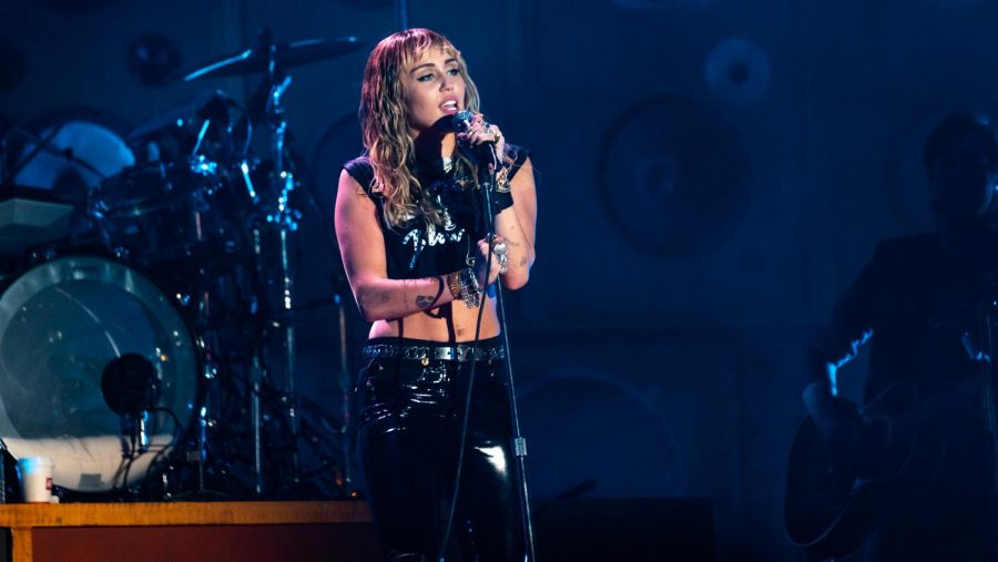 The above picture depicts Miley Cyrus performing in 2019.