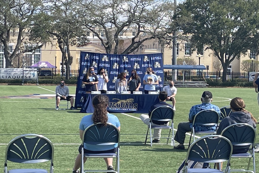 Seniors Grace Cronen, Rachel Petrarca, Jessica, Reynolds, Maddie Rodriguez, and Belle Sardja commit to their respective colleges at AHN’s Senior Signing.