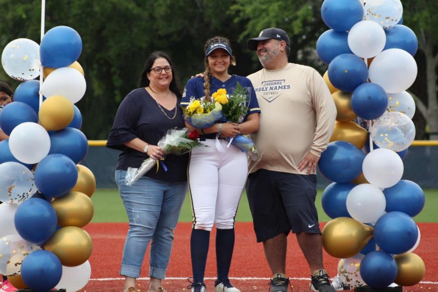 Chase Cordoves (21) and her parents on senior night. 