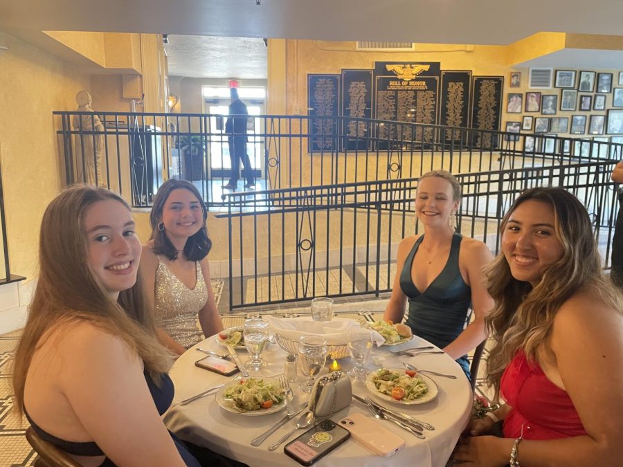 Carys Daly (23), Amelia Vitello (23) Kate Merrill (23) and Isabella Lawrence (23) pictured enjoying their salads before the main course.