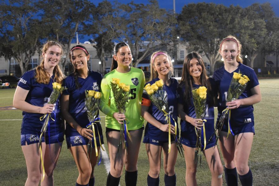 Academy of the Holy Names senior soccer team members pose together after being recognized for their extended contributions to their respective teams during their time at AHN high school. 