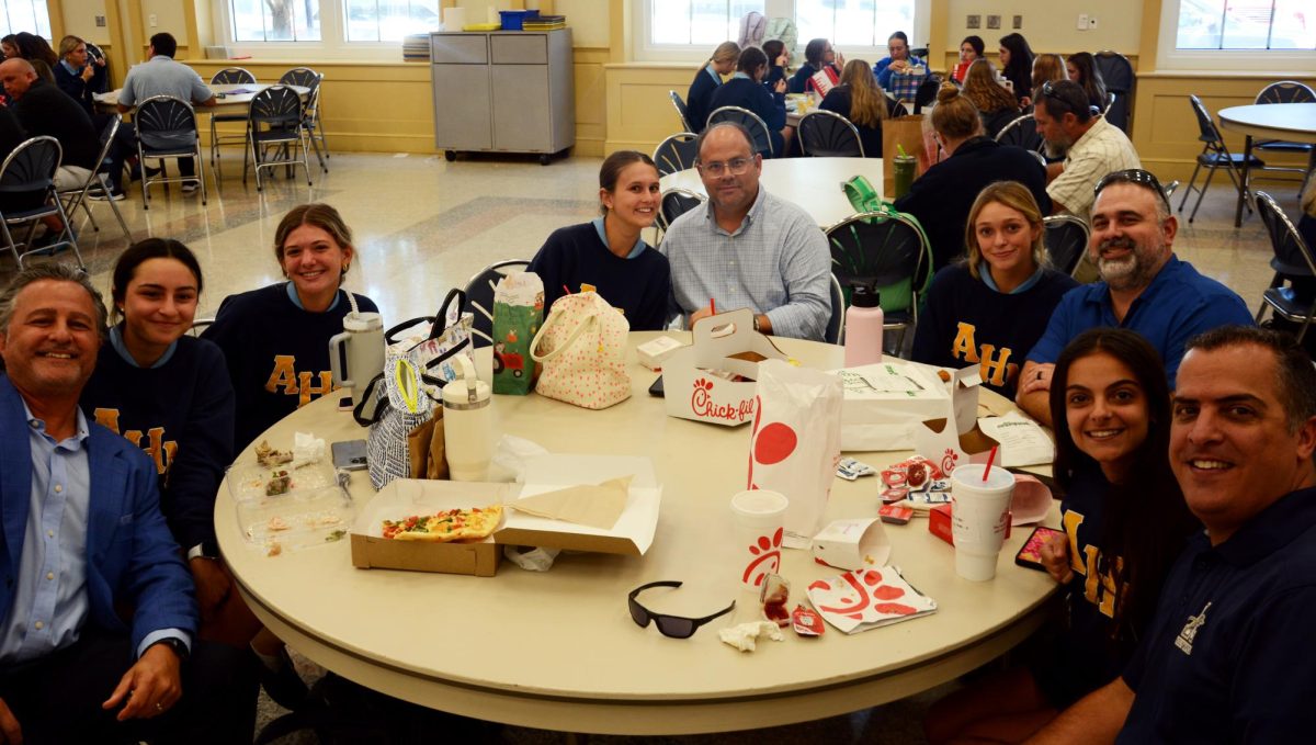 Students and their dads come together at the annual Lunch with Dads.