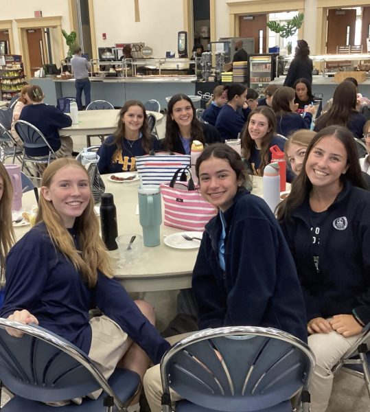 Sophomores enjoying their lunch together in the cafeteria