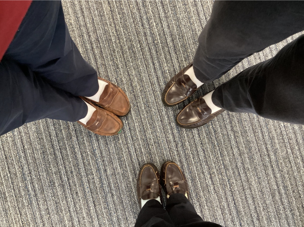 Senior Madison Pfeuffer and two of her friends in their penny loafers