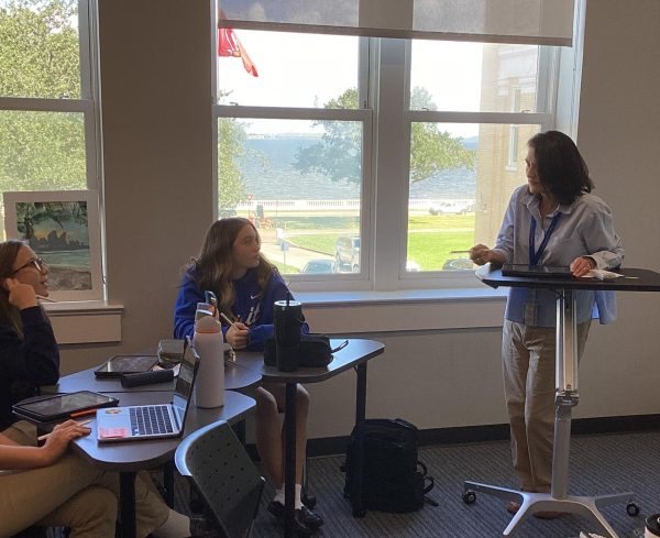 Laura Howard teacher her Algebra II students