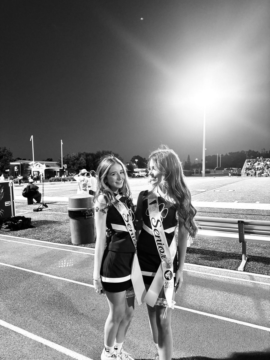 Senior Madison Pfeuffer and Annabelle Bennett on the sideline 