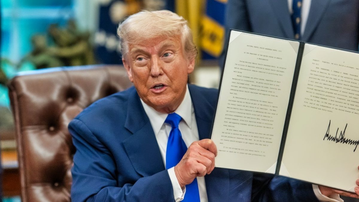President Donald Trump signs an executive order (Official White House Photo by Molly Riley).