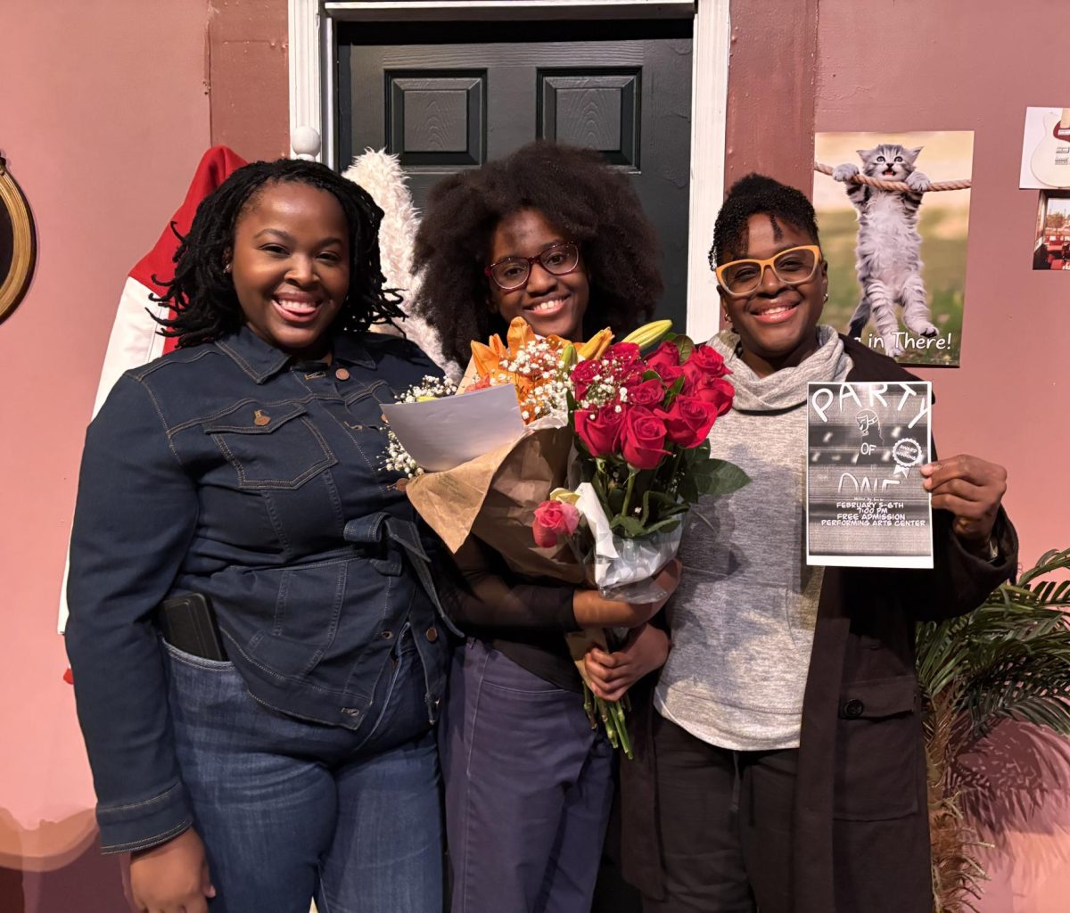 Imani Bell alongside family members after opening "Party of One".