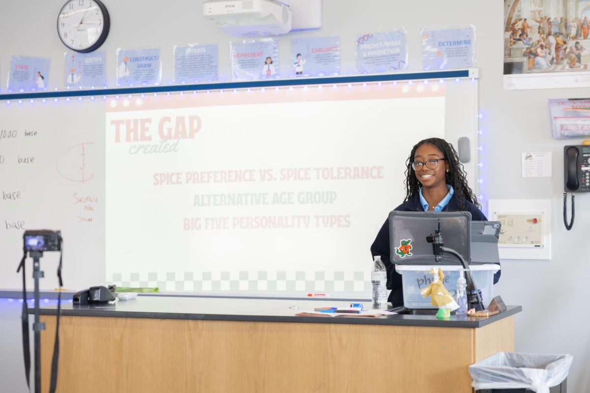 Tia Smith ('27) displays the work that led to her research gap.